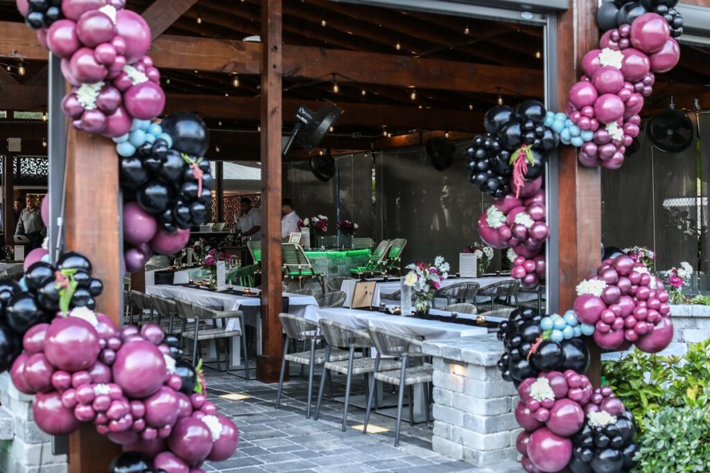 Magnolias' covered patio, decorated with balloon arrangements